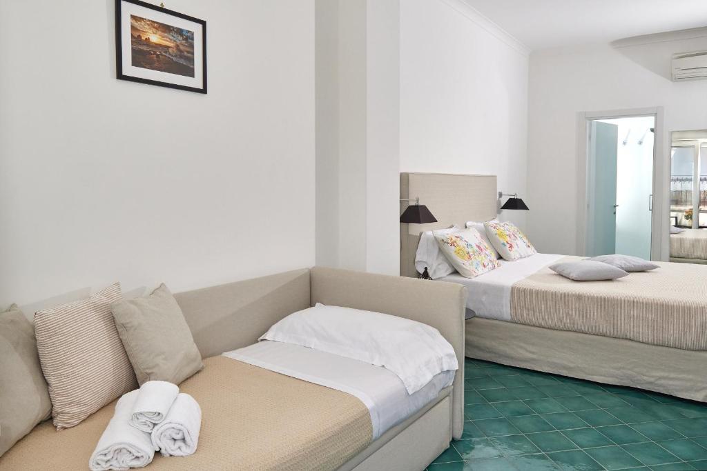 Postel nebo postele na pokoji v ubytování Hotel Victoria Place