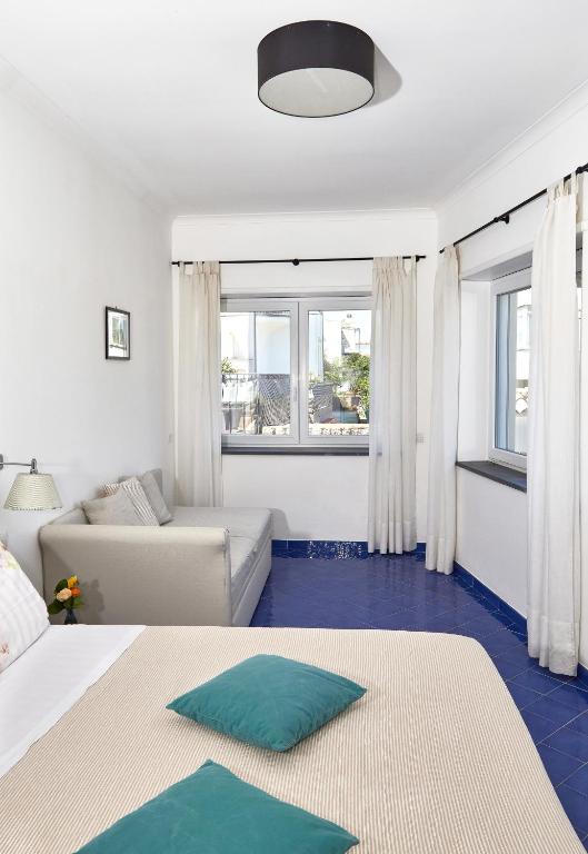 Postel nebo postele na pokoji v ubytování Hotel Victoria Place