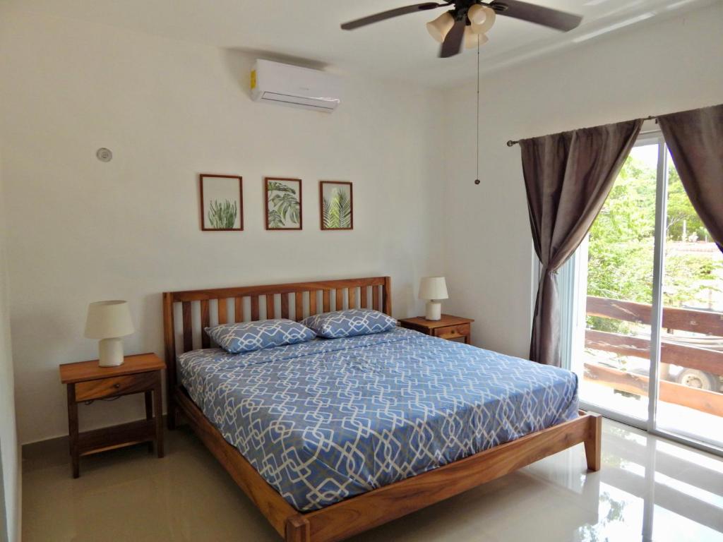 a bedroom with a bed and a ceiling fan at 2 BR-house in Puerto Morelos with stunning view in Puerto Morelos