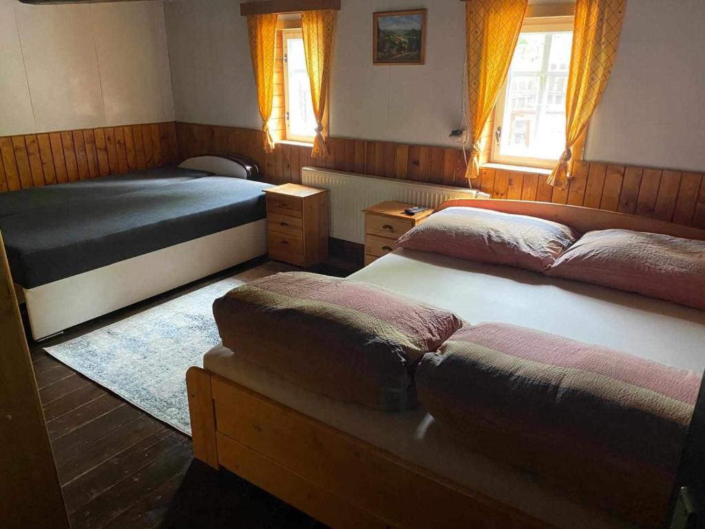 Postel nebo postele na pokoji v ubytování Chaloupka u lišáka