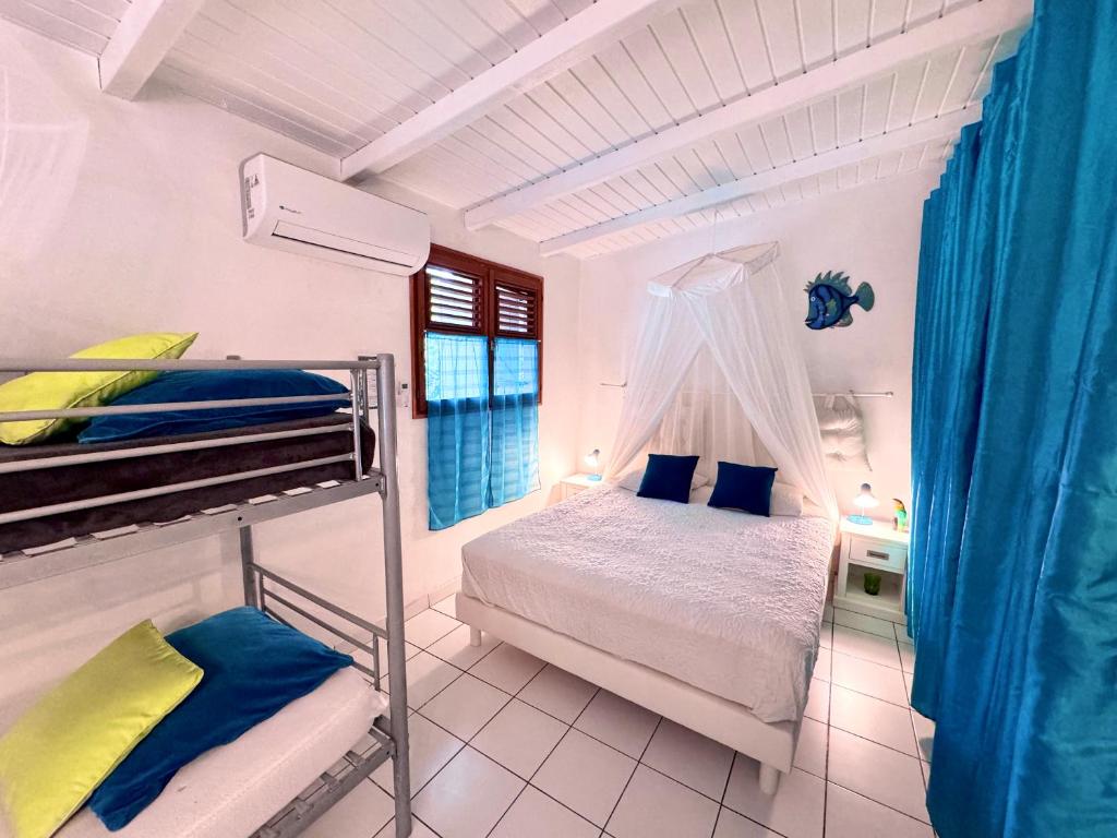 Postel nebo postele na pokoji v ubytování Au Jardin Des Colibris Ecolodge&Spa