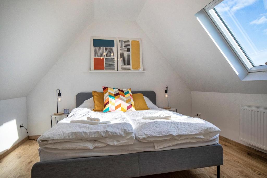 a bedroom with a large bed in a attic at 110 qm Penthousewohnung bei Bonn / Köln in Lohmar