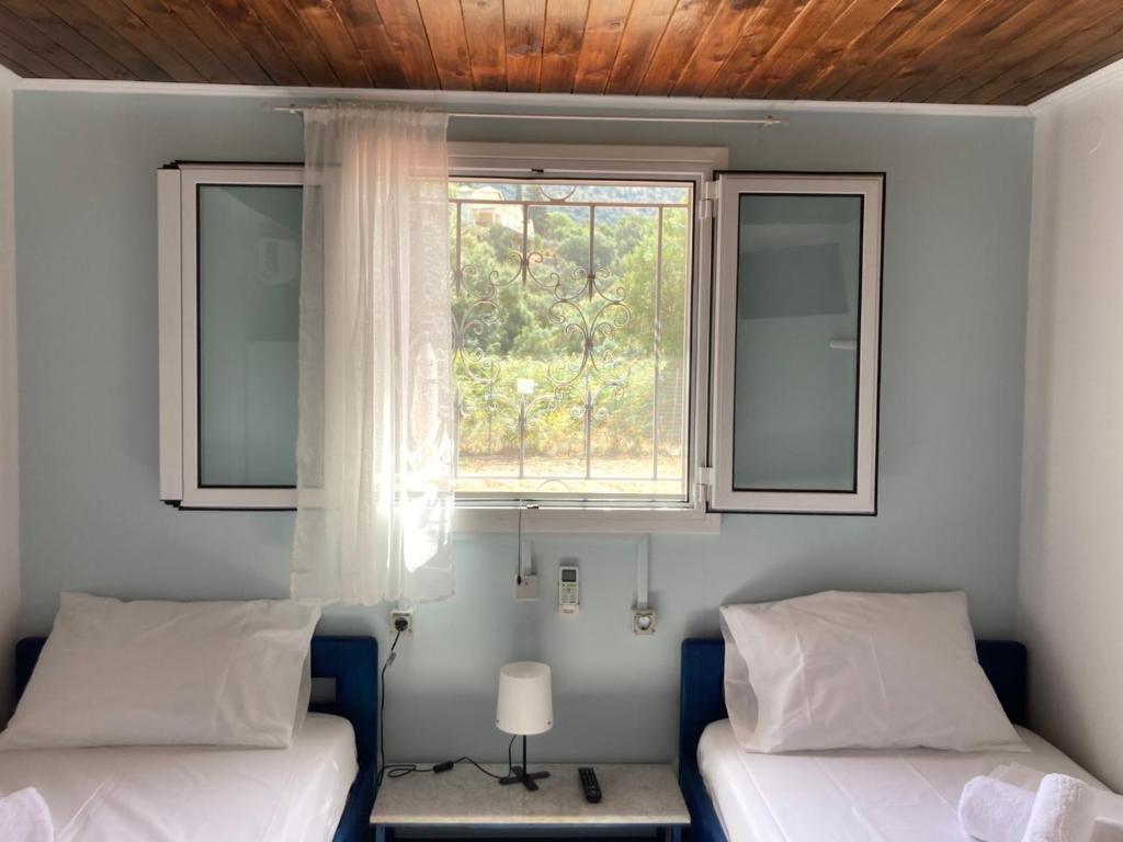 Postel nebo postele na pokoji v ubytování Helios Beach House