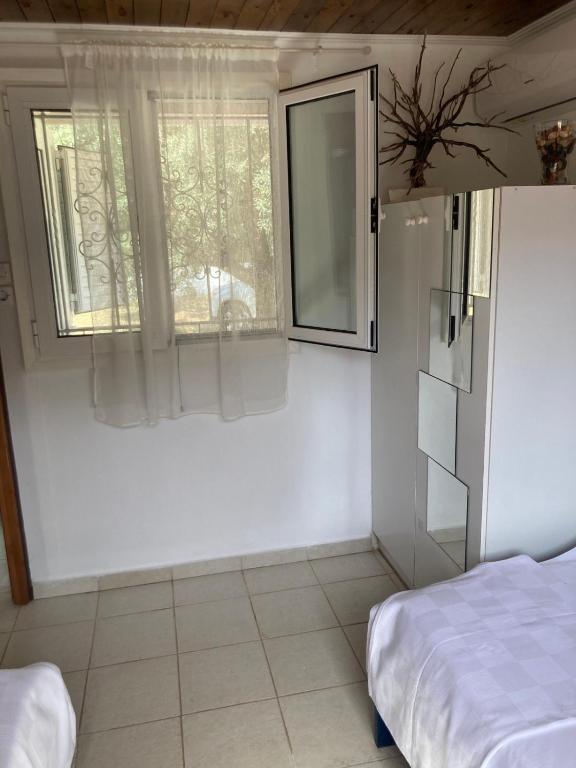 Postel nebo postele na pokoji v ubytování Helios Beach House