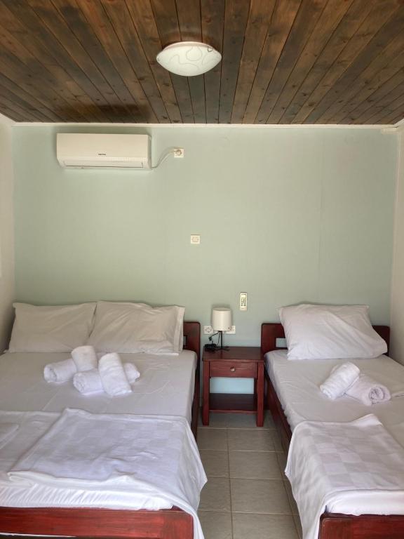 Postel nebo postele na pokoji v ubytování Helios Beach House
