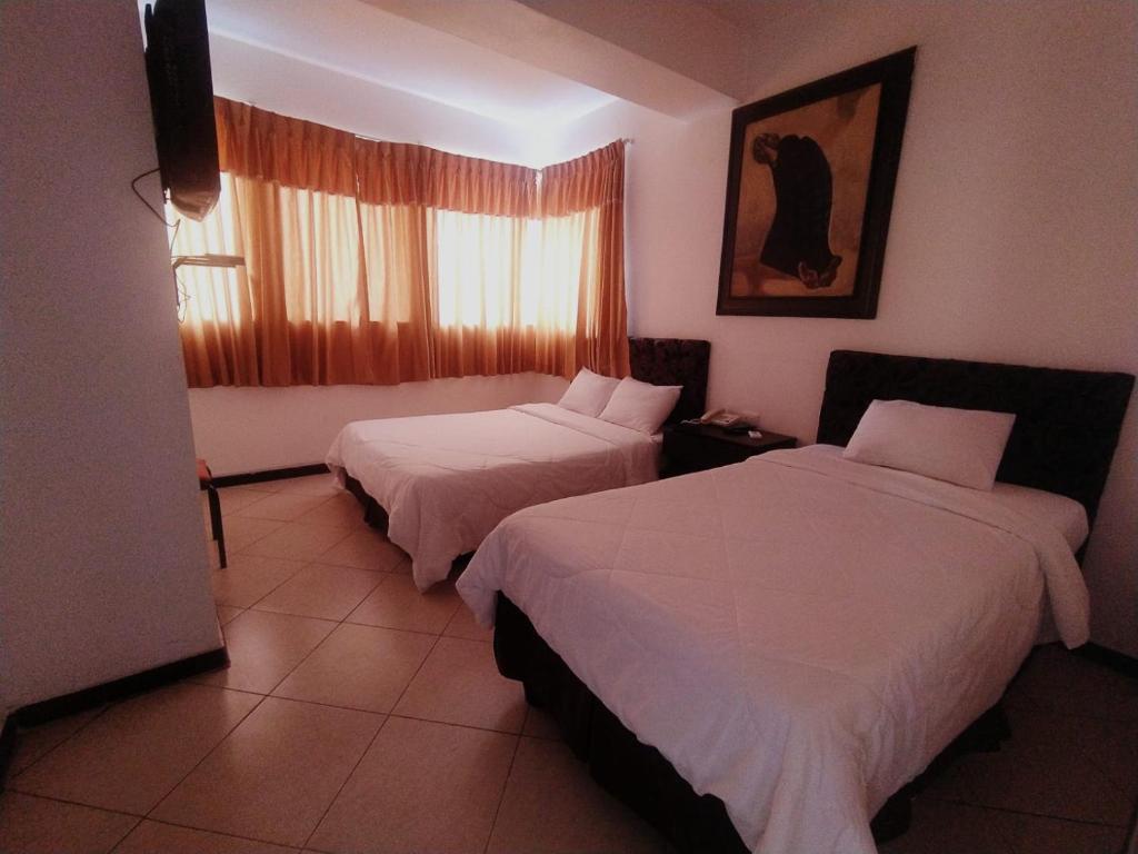 Postel nebo postele na pokoji v ubytování Hotel Presidente Beach Salinas