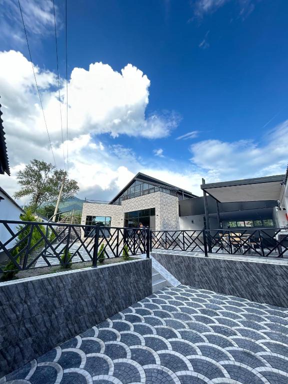 a view of a building with a blue sky at Luxury Milan Mountain Ponoramic Villa, indoor heated pool and jacuzzi with mountain view in Gabala