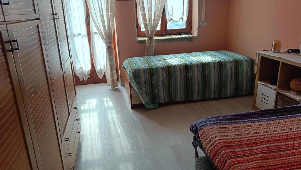Łóżko lub łóżka w pokoju w obiekcie La Magnolia B&B