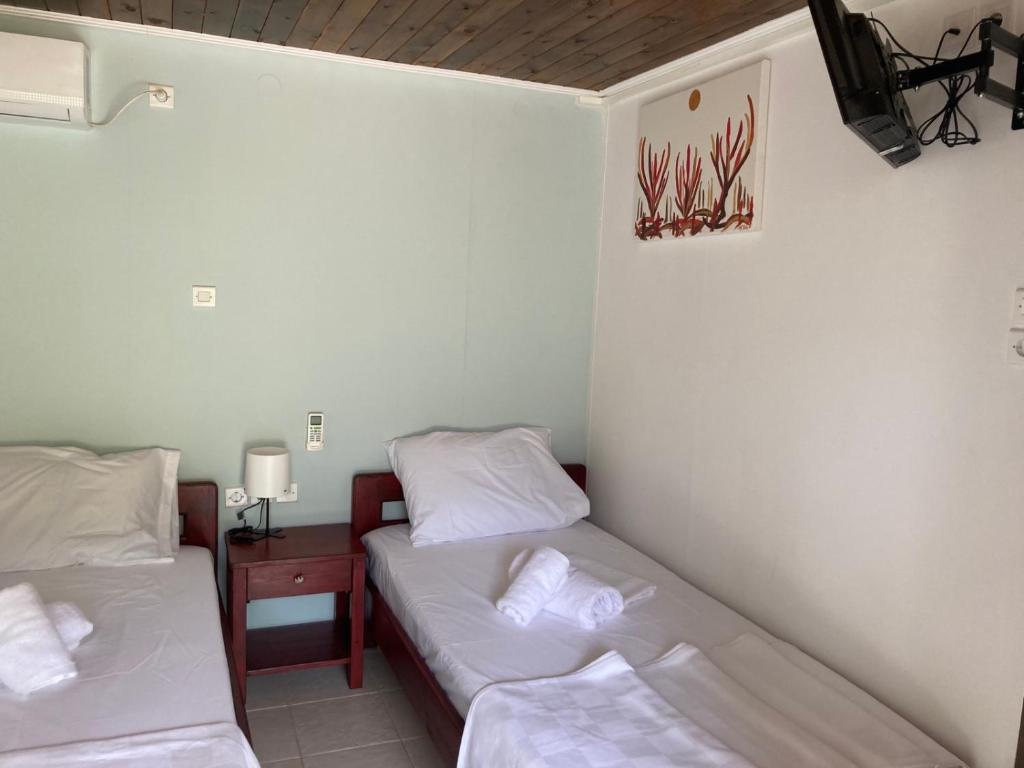 Postel nebo postele na pokoji v ubytování Helios Beach House