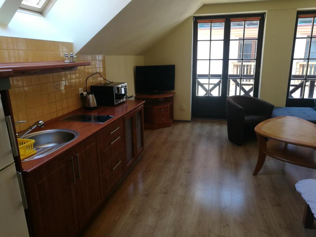 Kuchyňa alebo kuchynka v ubytovaní Mikołajki Apartamenty