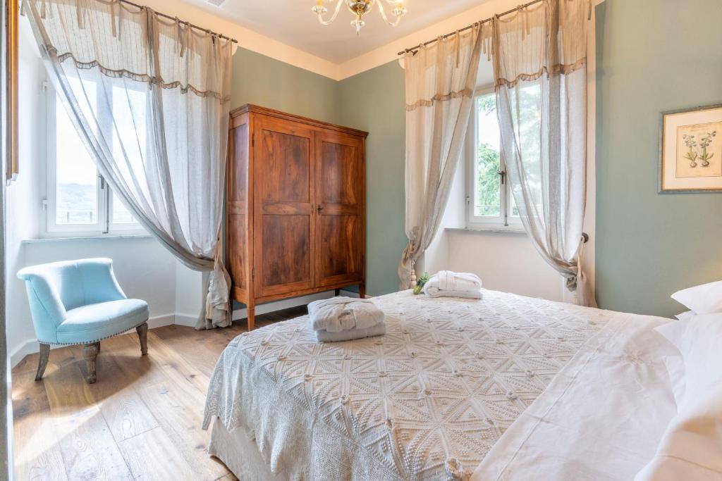 Postel nebo postele na pokoji v ubytování La Rocca di Camporgiano