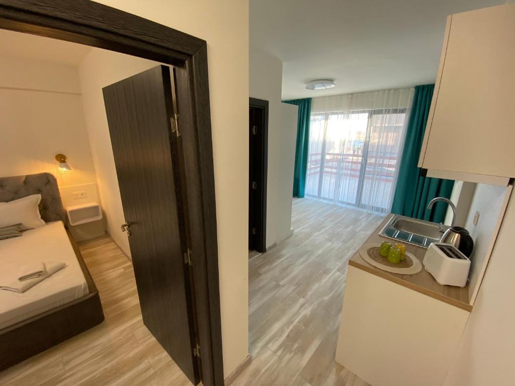 Postel nebo postele na pokoji v ubytování Sunny Beach Potos
