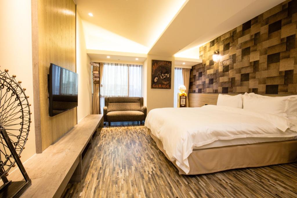 Postel nebo postele na pokoji v ubytování Walker Hotel. Ximen