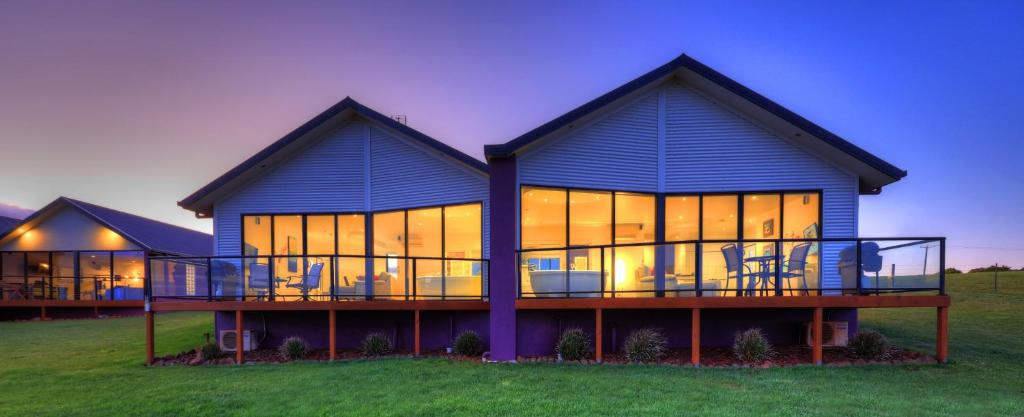 a large blue house with a lot of windows at Horizon Deluxe Apartments in Stanley