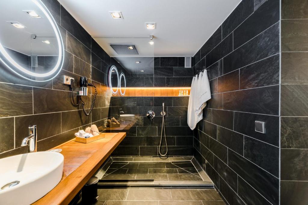 a bathroom with a sink and a shower at Hotel Boutique Ses Pitreras in San Antonio Bay