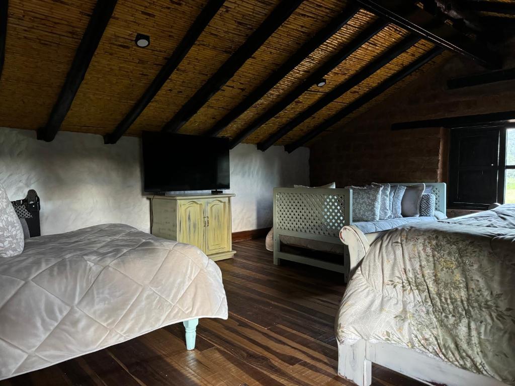 Postel nebo postele na pokoji v ubytování Casona Ananda