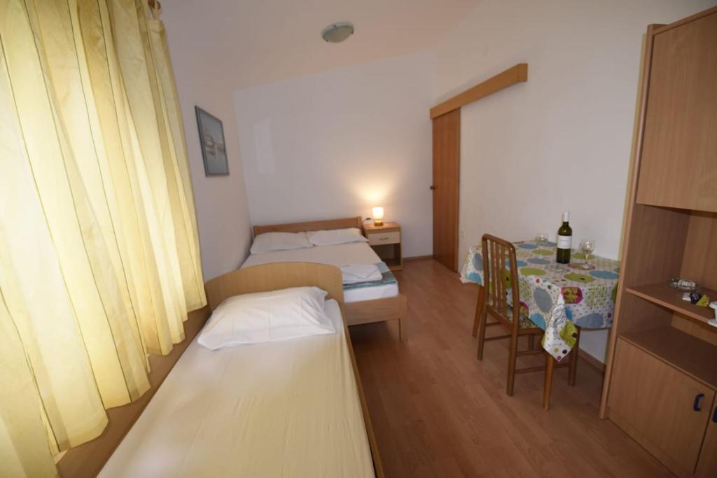 Postel nebo postele na pokoji v ubytování apartmani Puzek