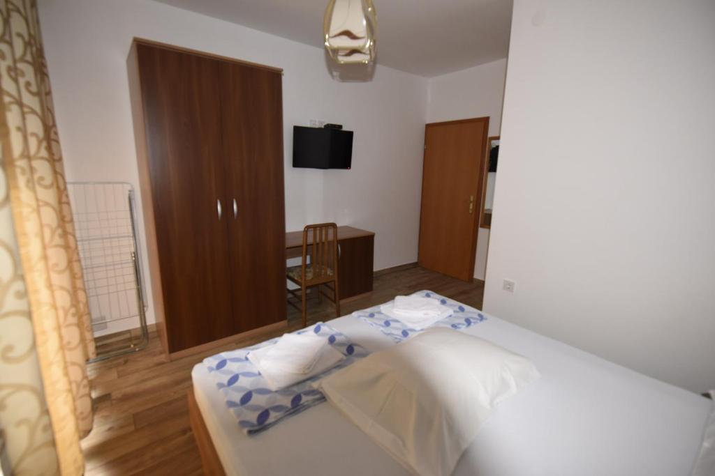 Postel nebo postele na pokoji v ubytování apartmani Puzek