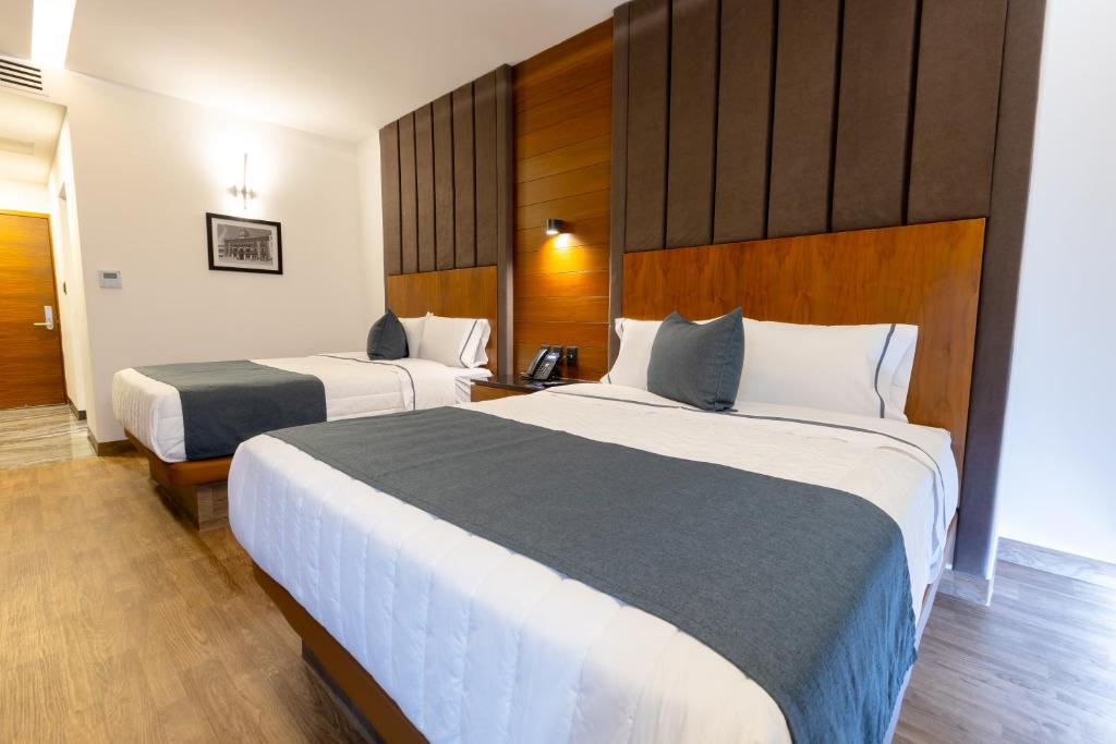 Postel nebo postele na pokoji v ubytování Hotel Noite Business Class