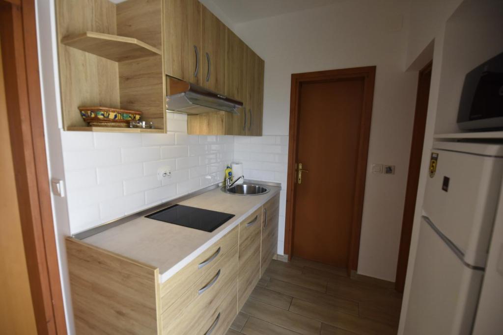 Kuchyň nebo kuchyňský kout v ubytování apartmani Puzek