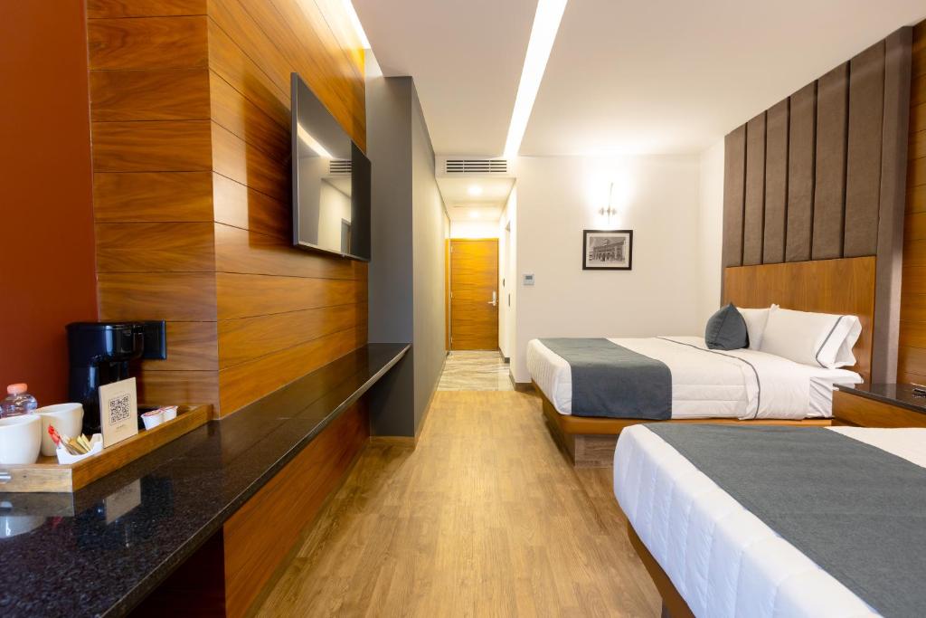 TV a/nebo společenská místnost v ubytování Hotel Noite Business Class