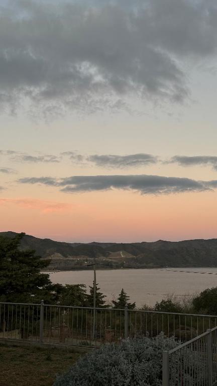 a view of a body of water at sunset at Casa vista panorámica al lago in Córdoba