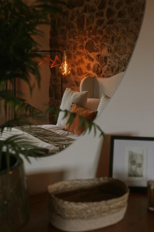 a room with a table with a chair and a lamp at The Bonnie Wee Bothy in East Linton