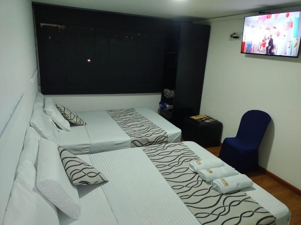 Postel nebo postele na pokoji v ubytování Hotel Bogotá la embajada