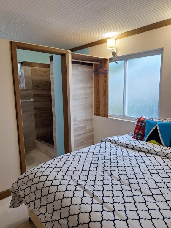 En eller flere senger på et rom på LE BLANC HIDEAWAY