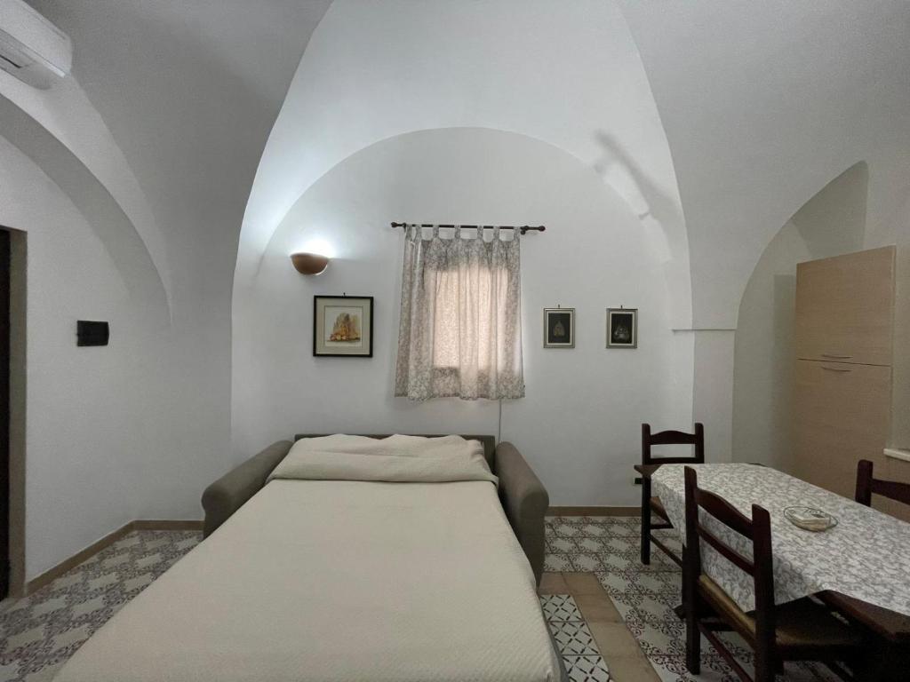 Postel nebo postele na pokoji v ubytování Masseria Triglie