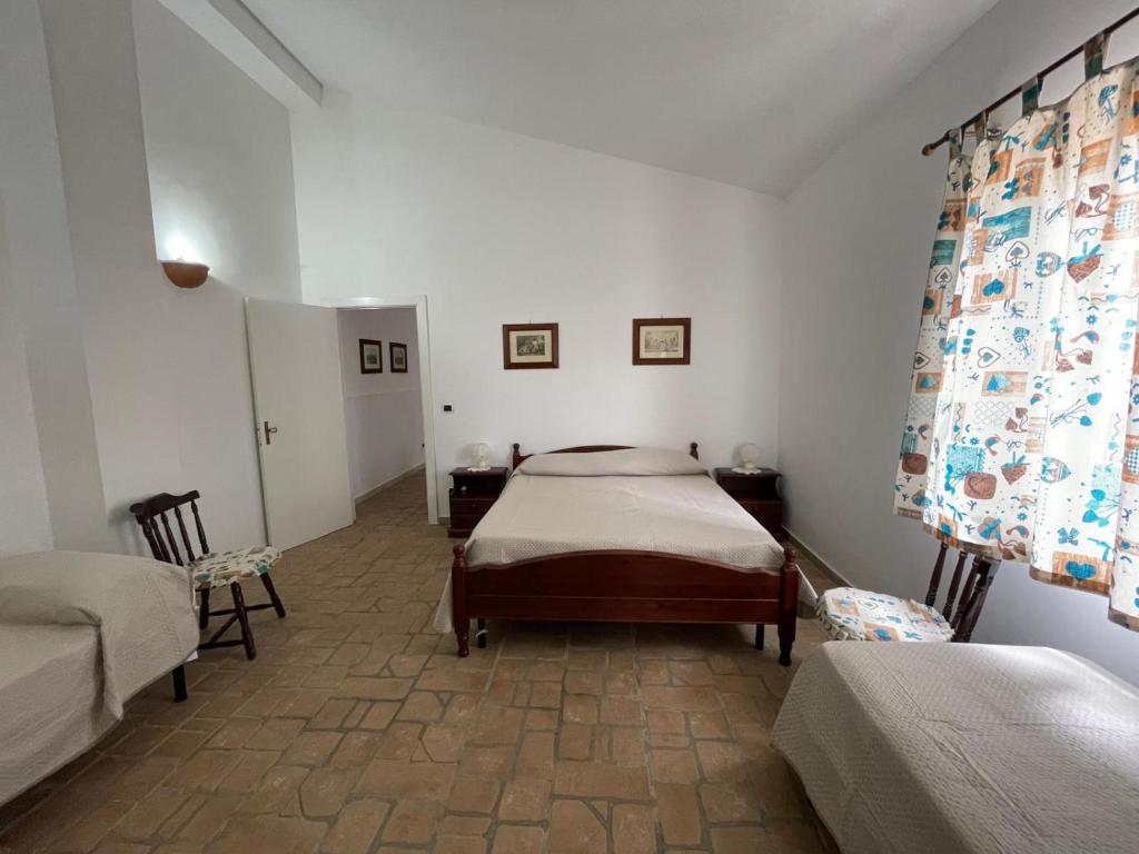 Postel nebo postele na pokoji v ubytování Masseria Triglie