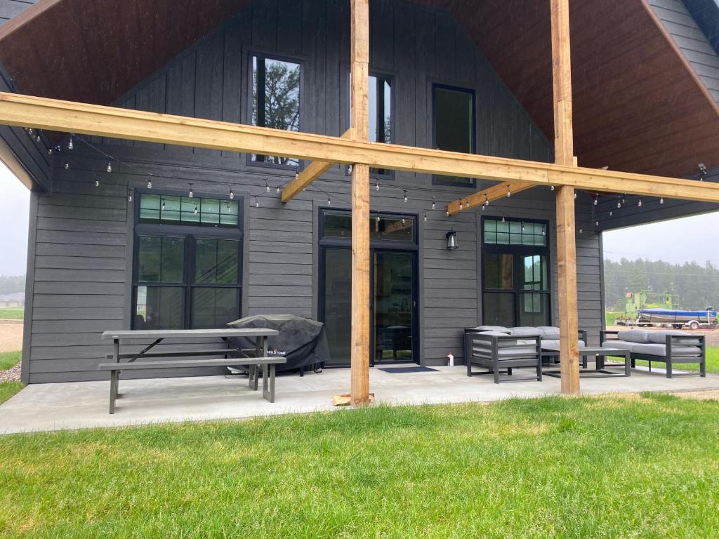 a group of benches on a patio in front of a building at Bearded Buffalo Resort in Custer