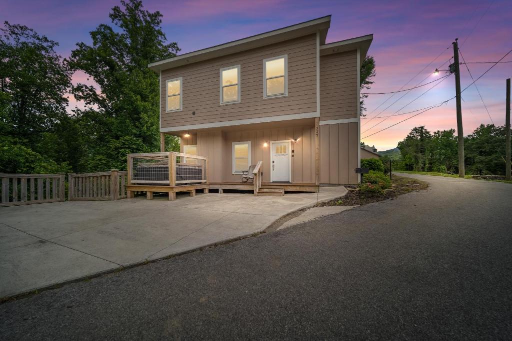 a small house with a bench in front of it at Private, Gatlinburg Bliss with Hot Tub and City Views in Gatlinburg