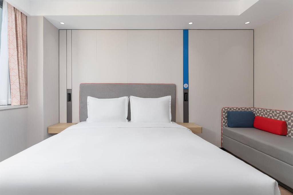 Postel nebo postele na pokoji v ubytování Holiday Inn Express Xi'an Daxing by IHG