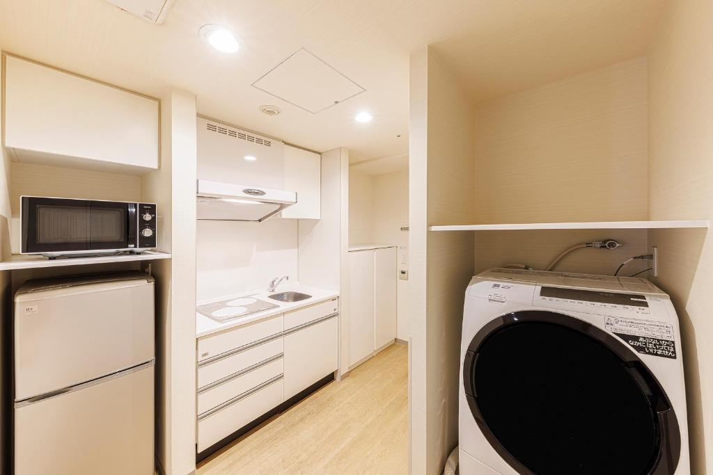 Kuchyň nebo kuchyňský kout v ubytování Fraser Residence Nankai Osaka
