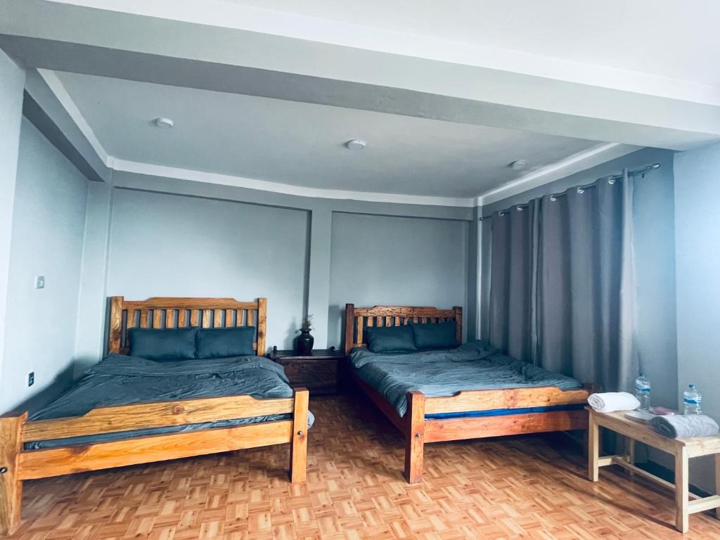Postel nebo postele na pokoji v ubytování Pasne Aajako Hotel
