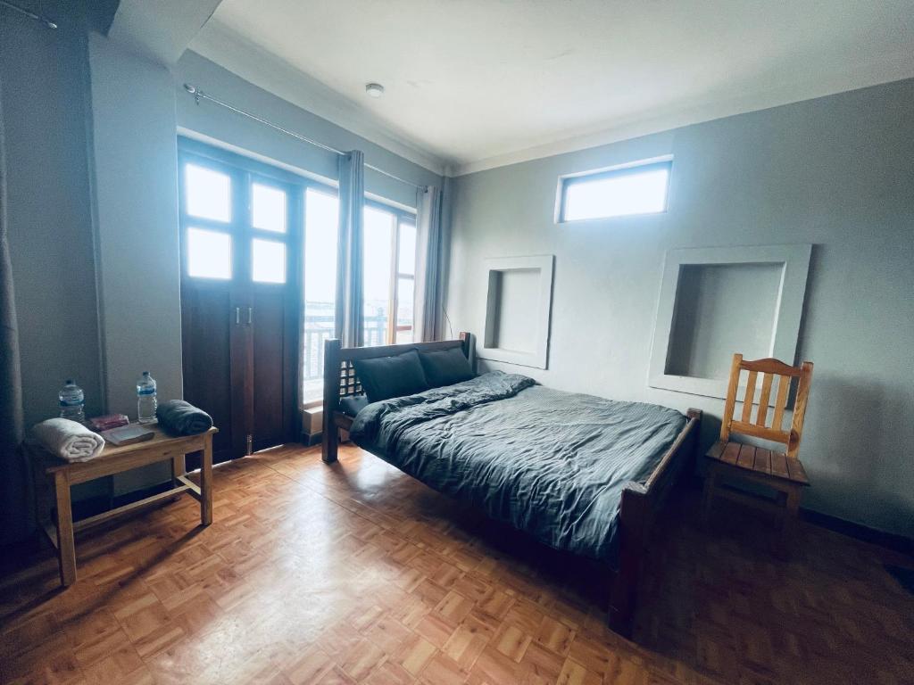 Postel nebo postele na pokoji v ubytování Pasne Aajako Hotel