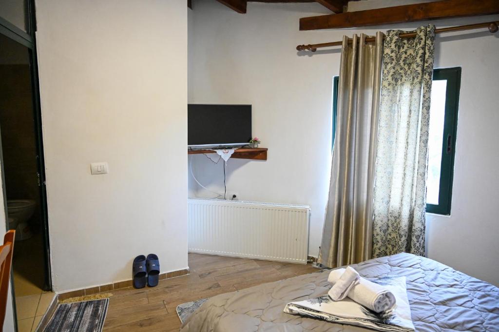 Postel nebo postele na pokoji v ubytování Joni Restaurant