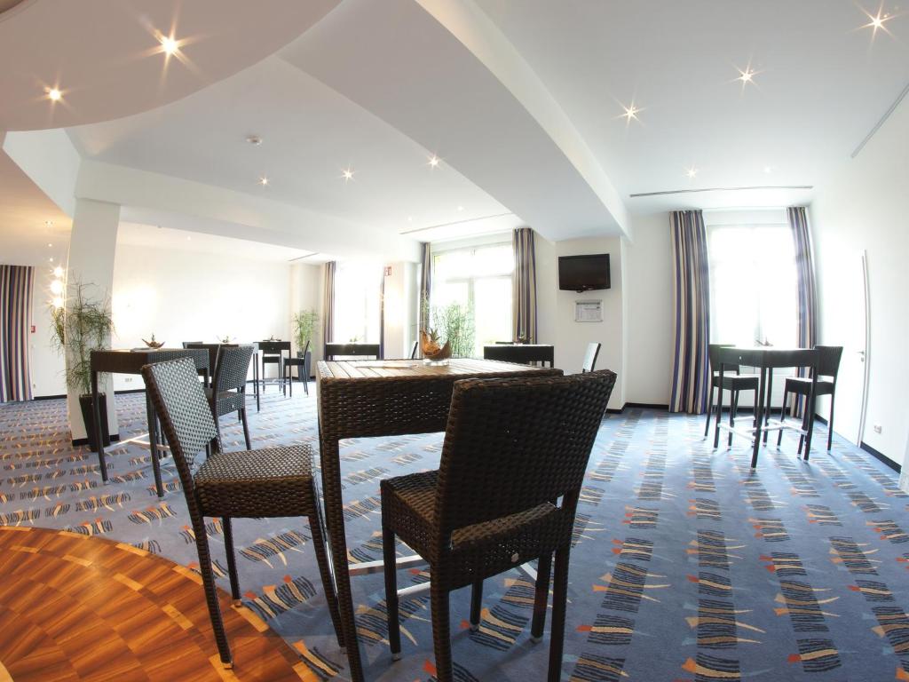 TV a/nebo společenská místnost v ubytování Atlanta Hotel Leipzig