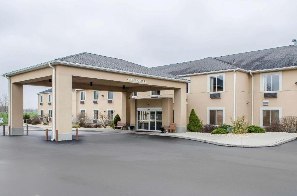 a building with a parking lot in front of it at Sleep Inn & Suites in Lancaster