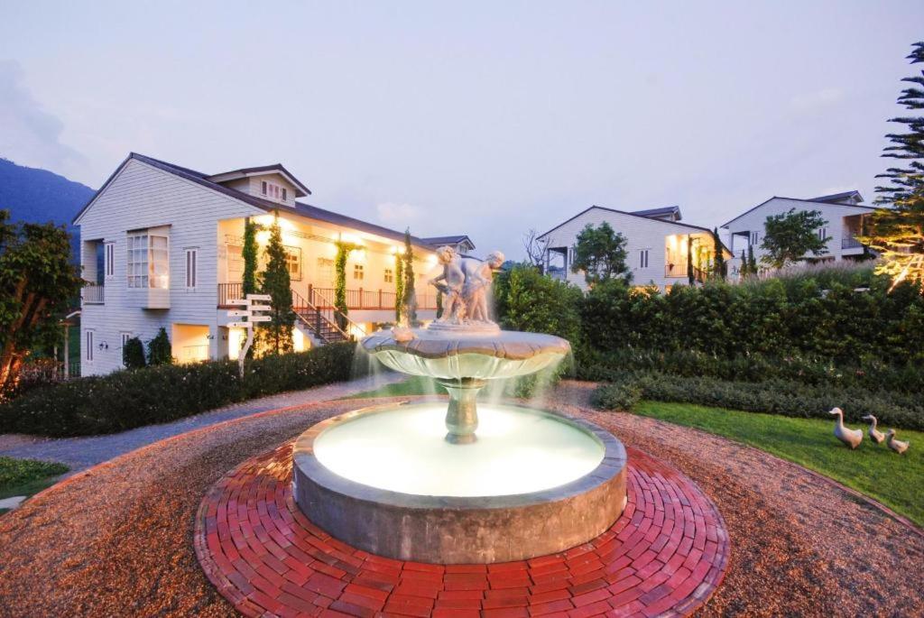 a fountain in the yard of a house at The Bluesky Resort @ Khao Kho in Campson
