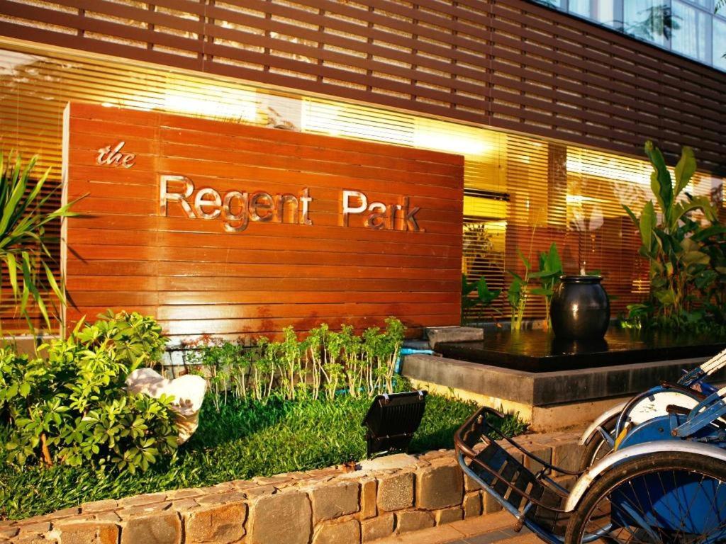 a resort park sign on the side of a building at Regent Park Hotel in Phnom Penh