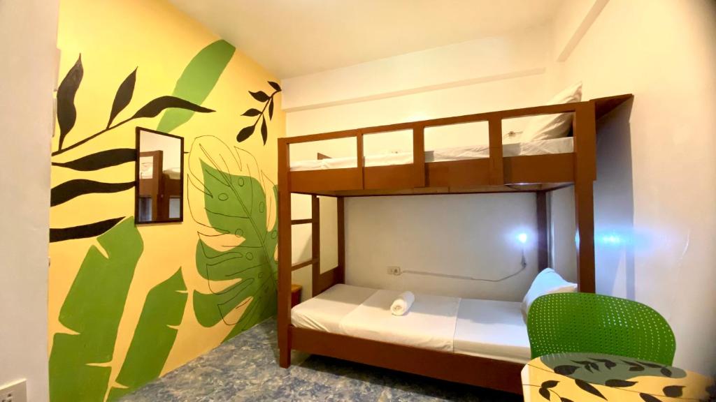 A bed or beds in a room at Chill Out Hostel