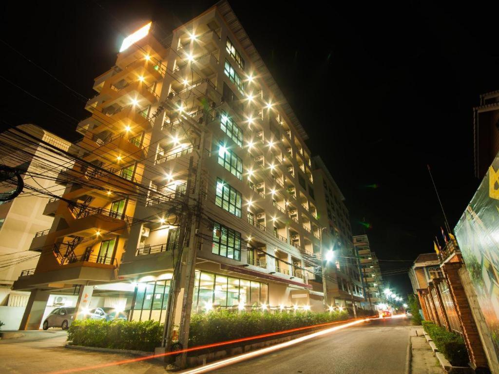 a large building with lights on it at night at Wsotel Hotel in Songkhla