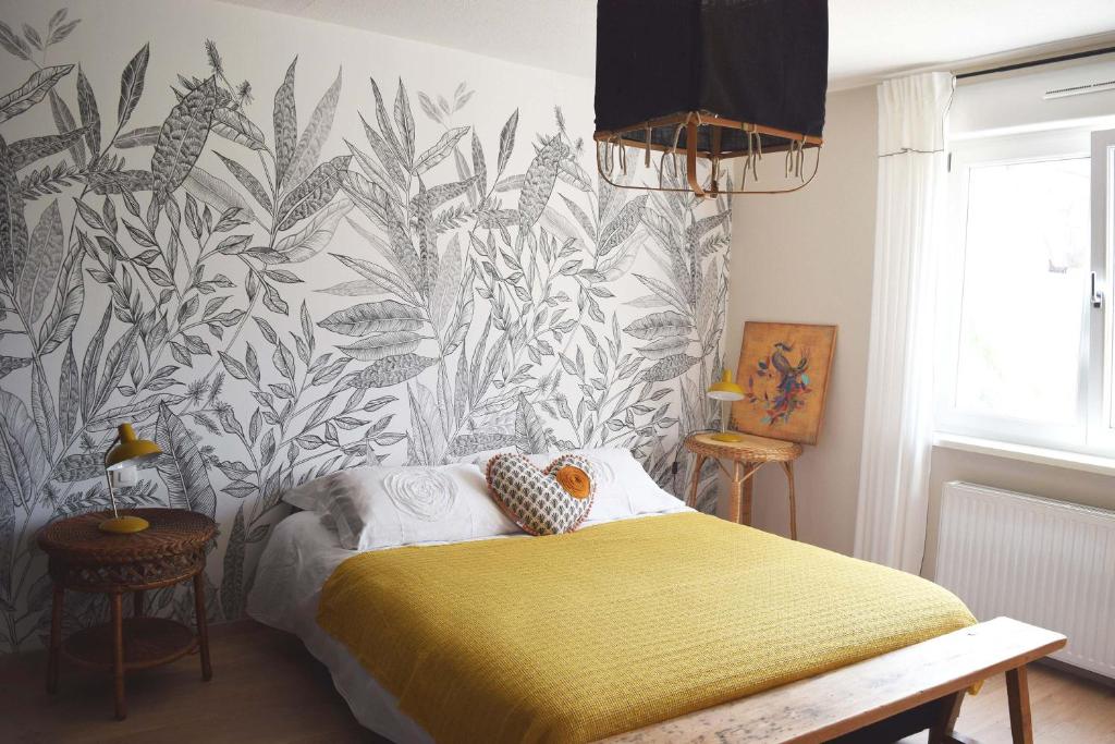 Ένα ή περισσότερα κρεβάτια σε δωμάτιο στο le loft de Nana