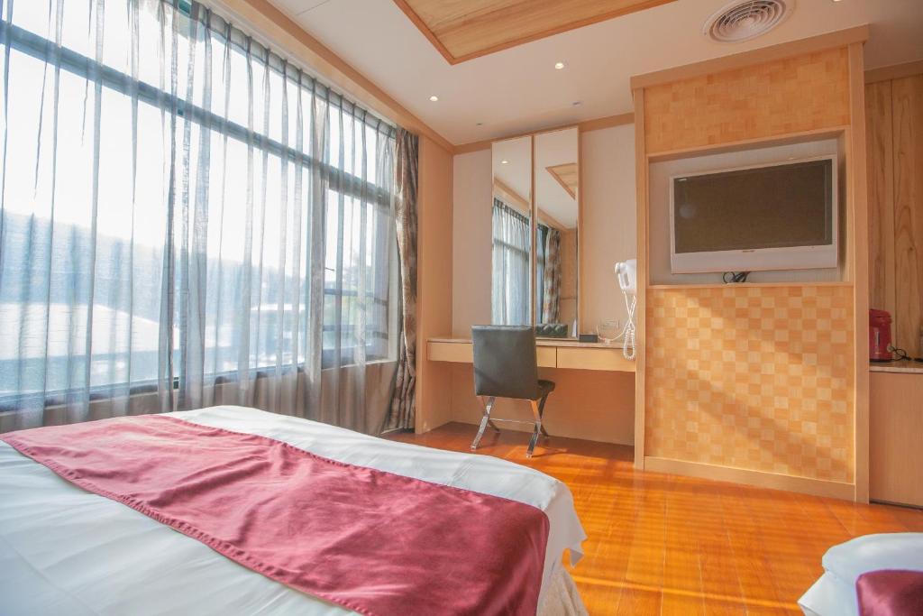 Postel nebo postele na pokoji v ubytování Shuian Lakeside Hotel