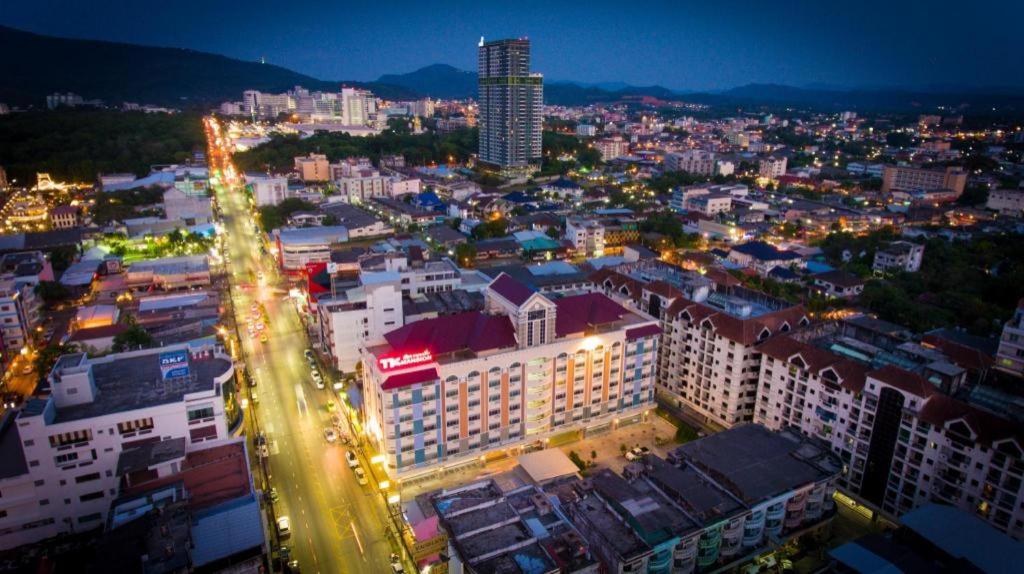 a city lit up at night with lights at TK Mansion in Ban Kohong