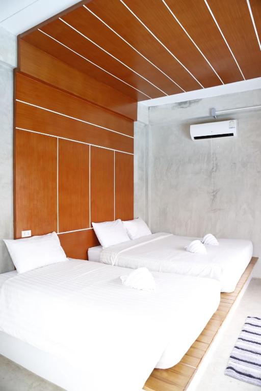 Postel nebo postele na pokoji v ubytování Virawan pool kohlarn วิราวัน พูล รีสอร์ท ที่พักเกาะล้าน