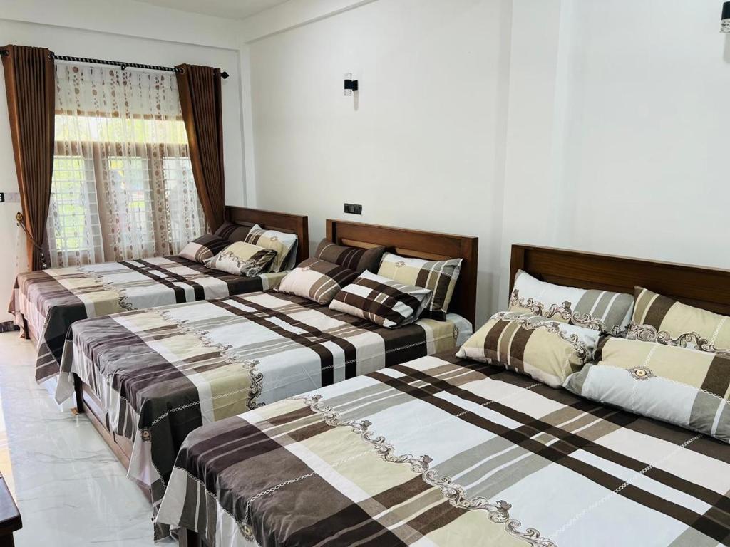Postel nebo postele na pokoji v ubytování Sea Zone Hotel Nilaveli