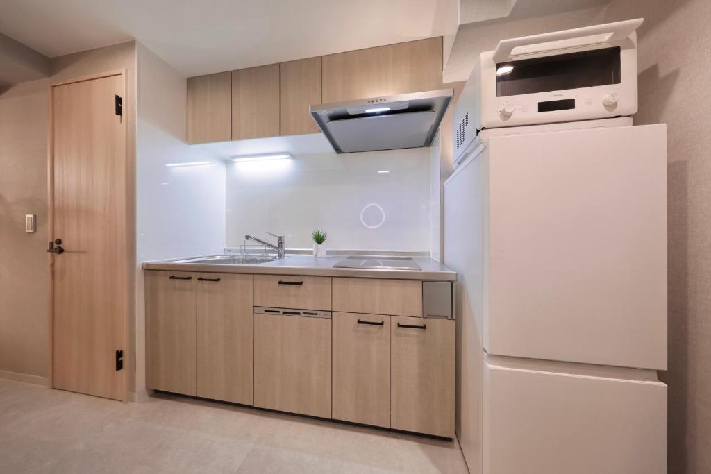 Kuchyň nebo kuchyňský kout v ubytování Dotombori Crystal Hotel 3